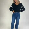 Jeans denim azul tachuelas
